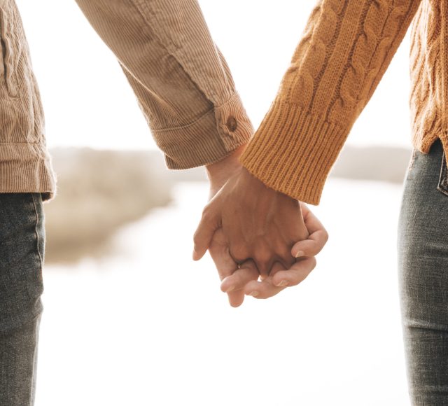 back-view-couple-holding-hands